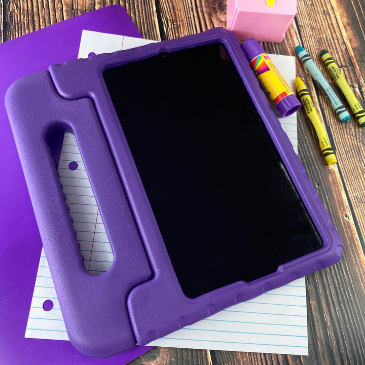 A tablet covered in a purple foam case. The case has a handle. #color_purple