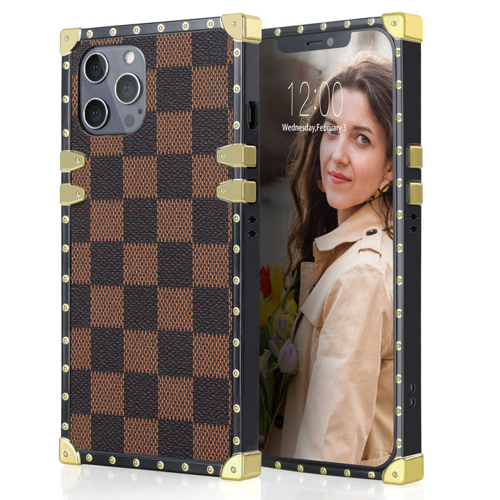 A box-shaped, TPU, iPhone 12 Pro Max case, with gold corner bumpers and gold rivets on its black borders. The case’s back is designed with brown and black checkered boxes. #color_brown-checkered