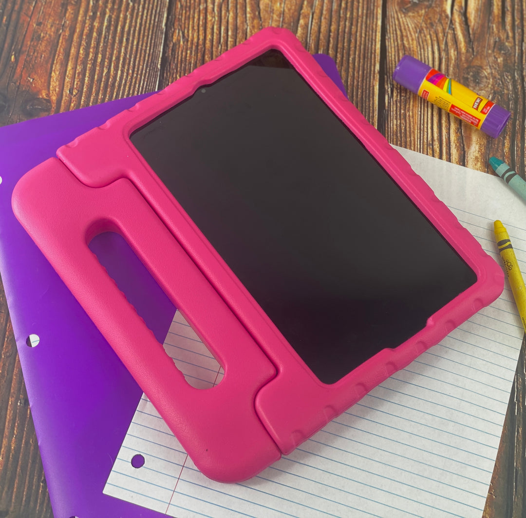 A tablet covered in a pink foam case. The case has a handle. #color_hot-pink