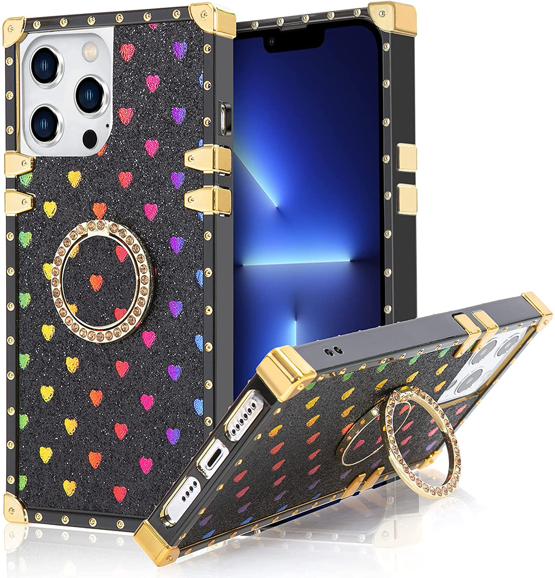 An Apple iPhone 13 Pro Max TPU case; ring-handle-kickstand; rectangular-shaped; black trim with gold-rivets; gold corner bumpers; with glittery-rainbow hearts in a black backdrop. #color_black-glittery-hearts 