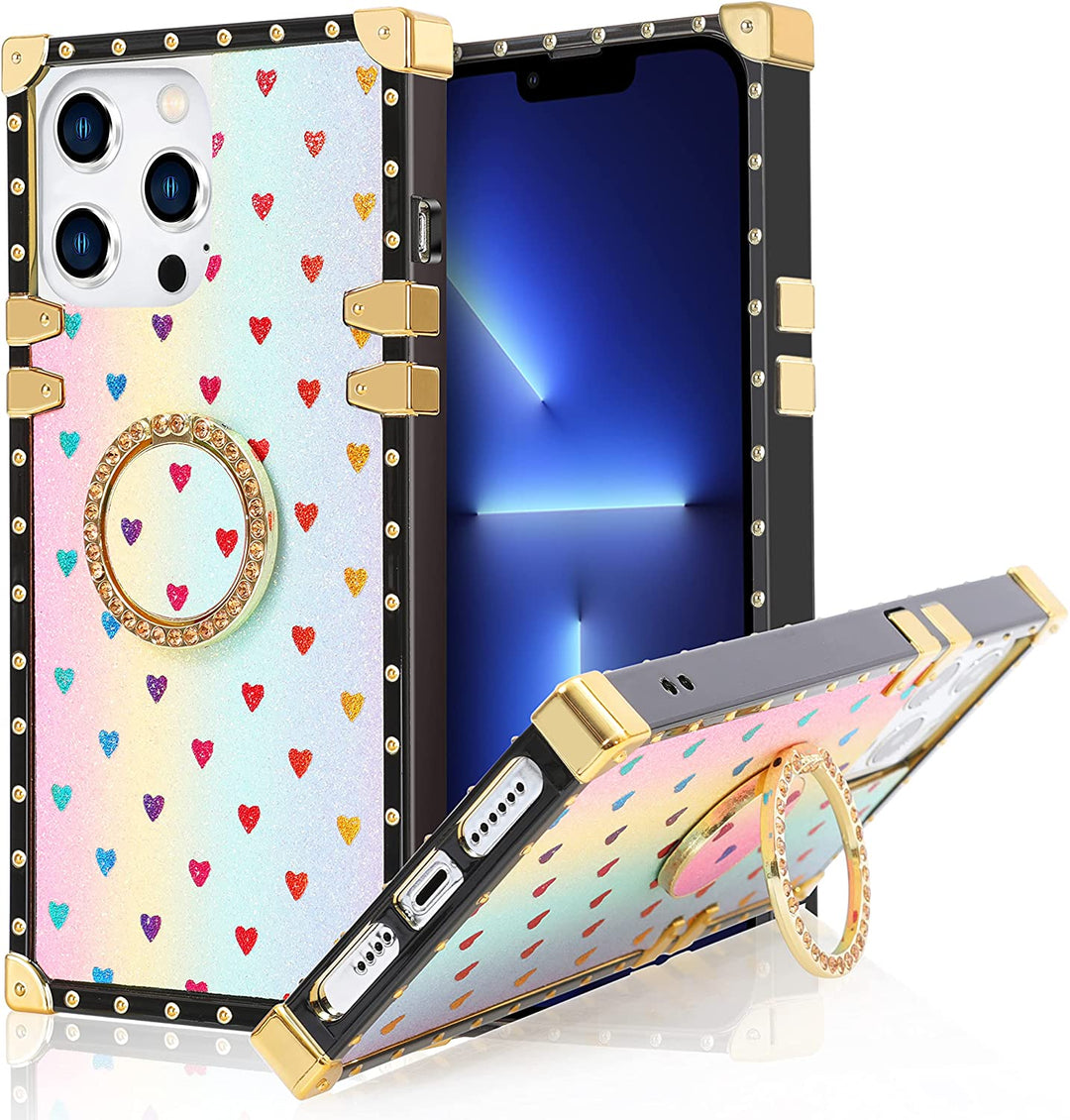 An Apple iPhone 13 Pro TPU case; ring-handle-kickstand; rectangular-shaped; black trim with gold-rivets; gold corner bumpers; with glittery-rainbow hearts in a rainbow backdrop. #color_rainbow-glittery-hearts