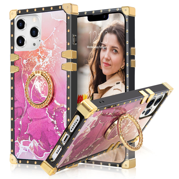 A box-shaped, TPU, iPhone 12 Pro Max case, with gold corner bumpers and gold rivets on its black borders. The case’s back is designed with pink marble color. It also has a gold trim ring that doubles as a handle and kickstand. #color_marble-holo-light-pink-hot-pink