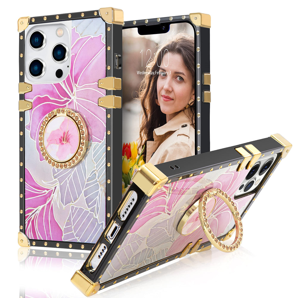 An Apple iPhone 13 Pro case; ring-handle-kickstand; rectangular-shaped; black trim with gold-rivets; gold corner bumpers; and pink flowers with silver outlines. #color_pink-flower-silver-holo