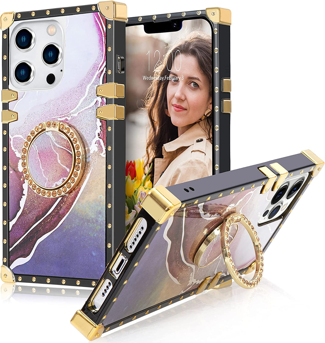 An Apple iPhone 13 Pro case; ring-handle-kickstand; rectangular-shaped; black trim with gold-rivets; gold corner bumpers; with pink-purple marble pattern. #color_marble-holo-purple-pink
