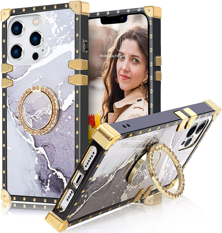 An Apple iPhone 13 Pro case; ring-handle-kickstand; rectangular-shaped; black trim with gold-rivets; gold corner bumpers; with white-gray marble pattern. #color_marble-holo-white