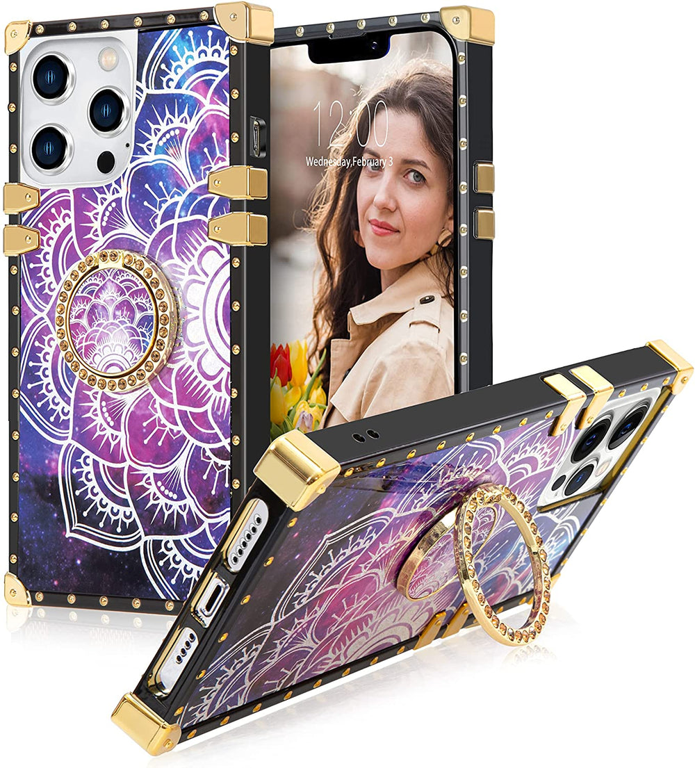  A box-shaped TPU case with gold corner bumpers and gold rivets on its black borders. The case’s back design has a white-half lotus outline in a blue-purple cosmic backdrop. The case also has a gold ring handle that doubles as a holder and kickstand. #color_holo-purple-cosmo-silver-lotus